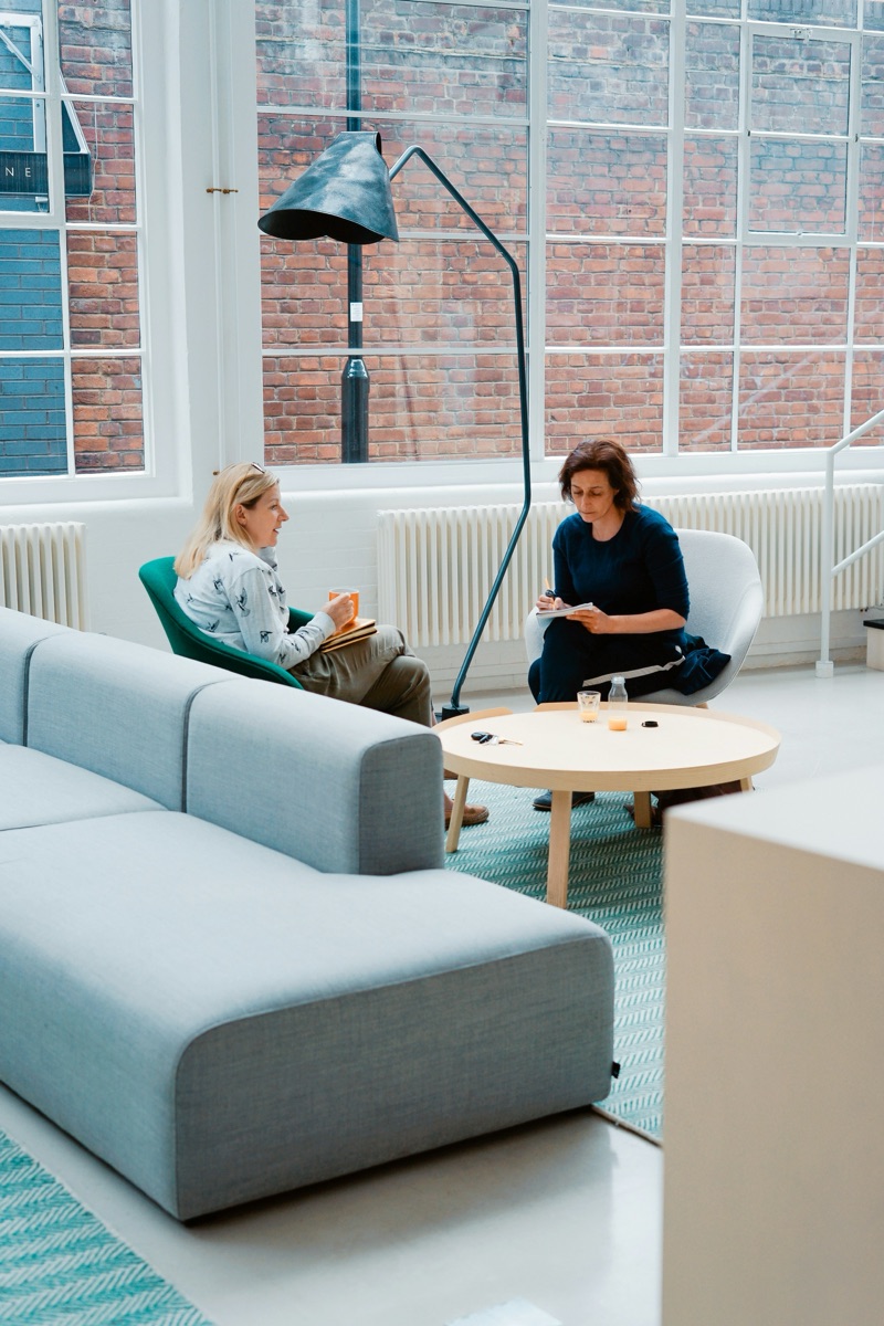 Two people in a one-to-one coaching conversation